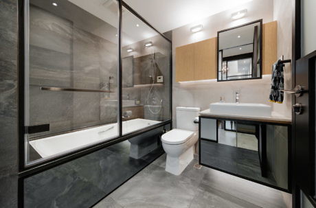 Contemporary bathroom with glass shower and sleek fixtures.