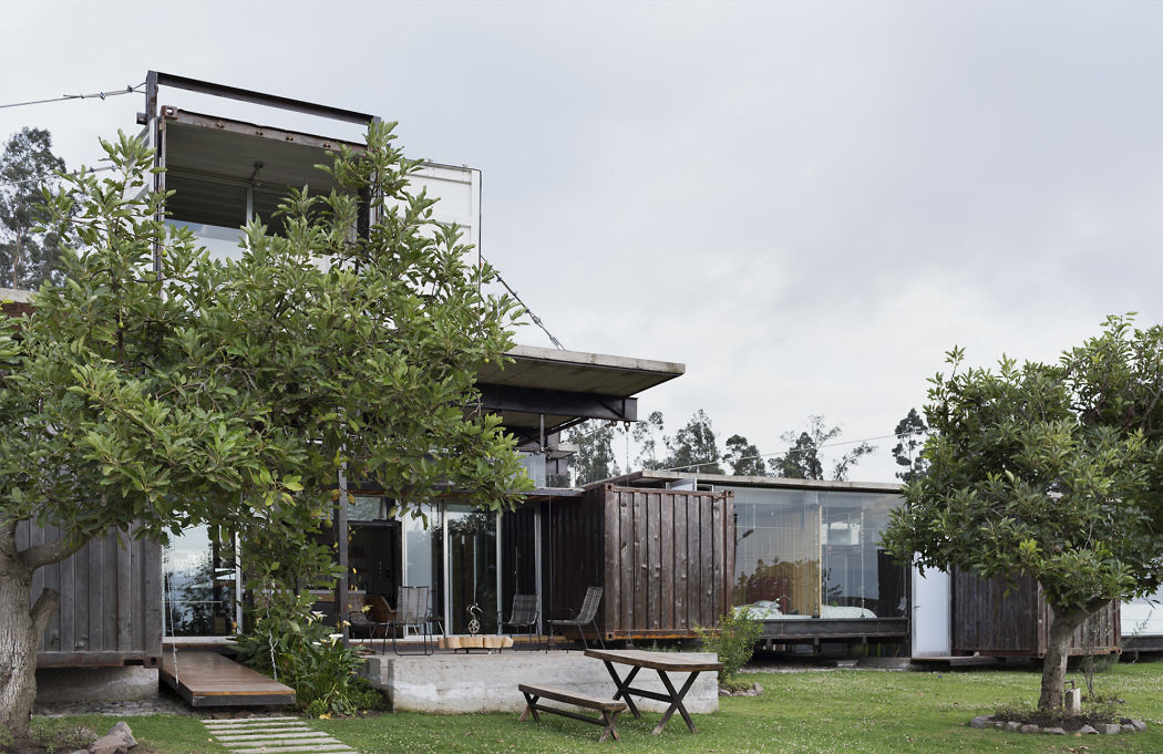 Contemporary house with large windows amidst greenery