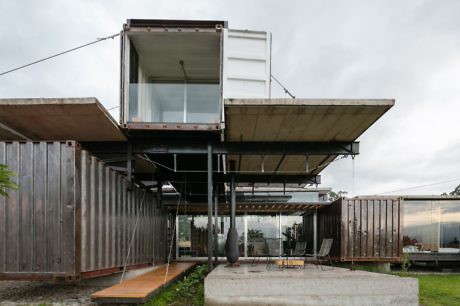 Modern home made from shipping containers with a cantilevered design.