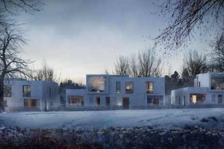 Modern houses with illuminated windows in a snowy landscape at dusk.