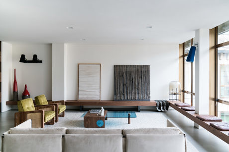 Minimalist living room with neutral tones and contemporary furniture.