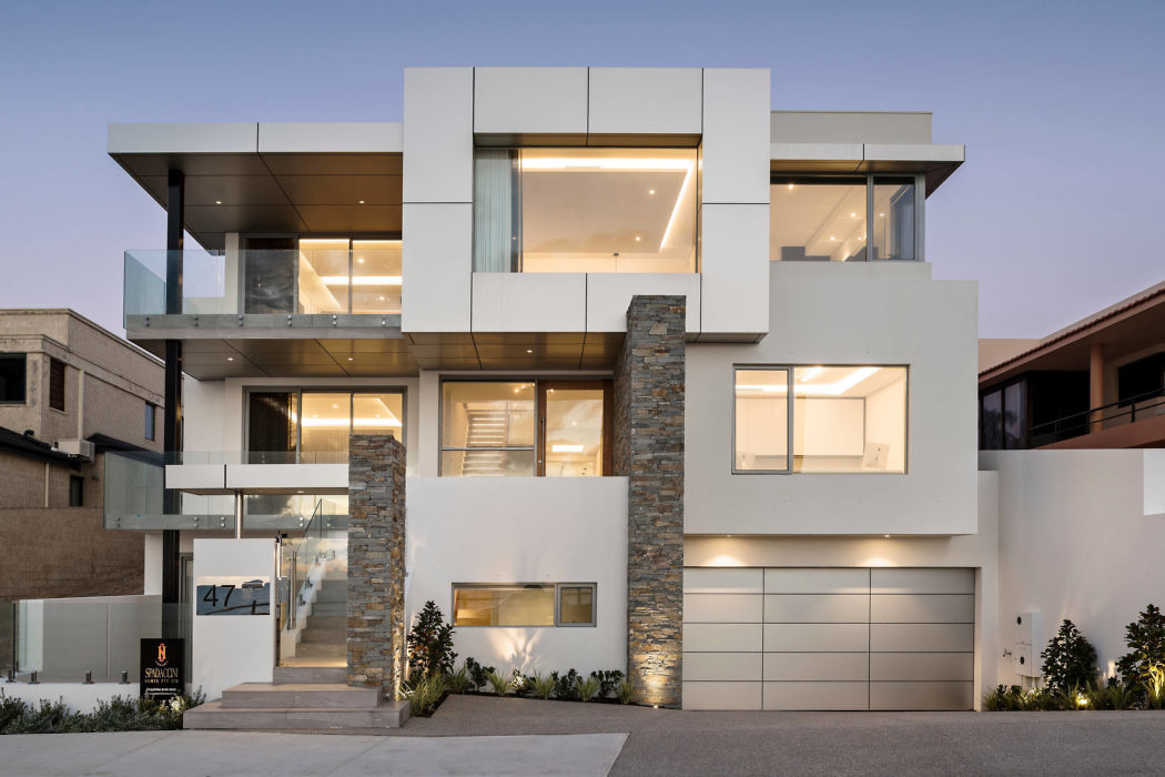 Contemporary home with geometric design and ample glass.