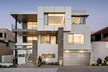 Contemporary home with geometric design and ample glass.