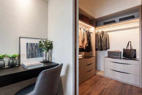 Contemporary home office nook with adjoining walk-in closet.