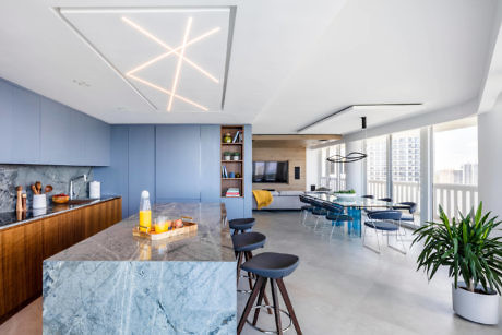 Sleek kitchen with star-shaped lights and marble island