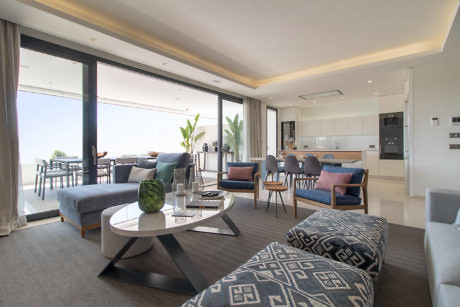 Contemporary living room with open floor plan and ocean view.