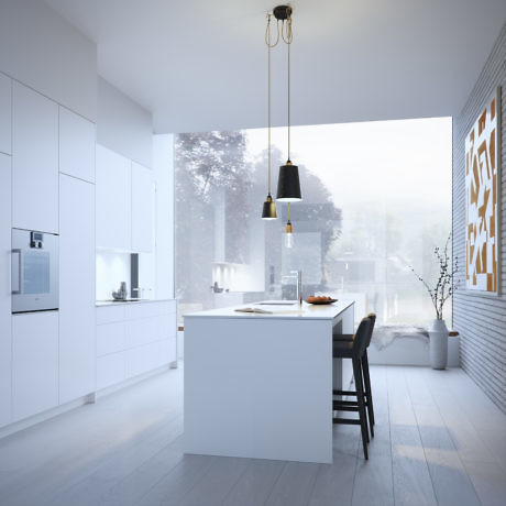Modern kitchen with white cabinets, island, and pendant lights.