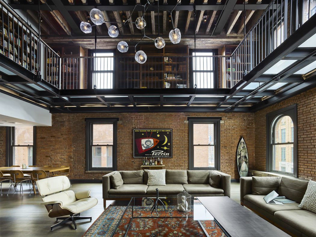 Industrial-chic loft with exposed brick walls and wooden beams.