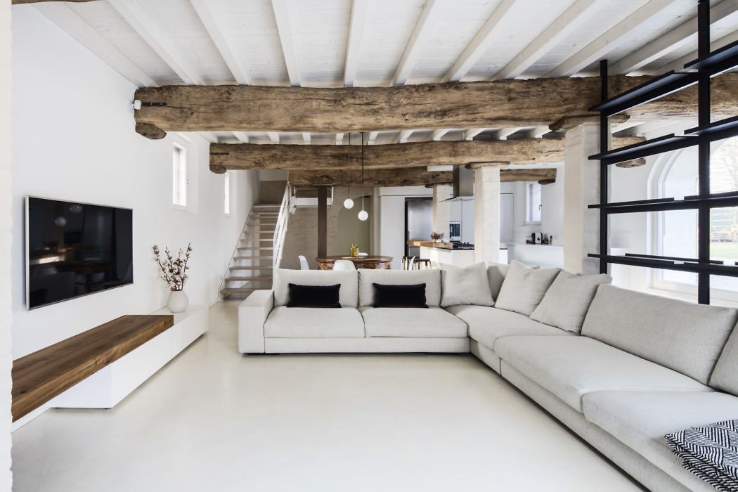 Contemporary living room with exposed wooden beams and minimalist decor.