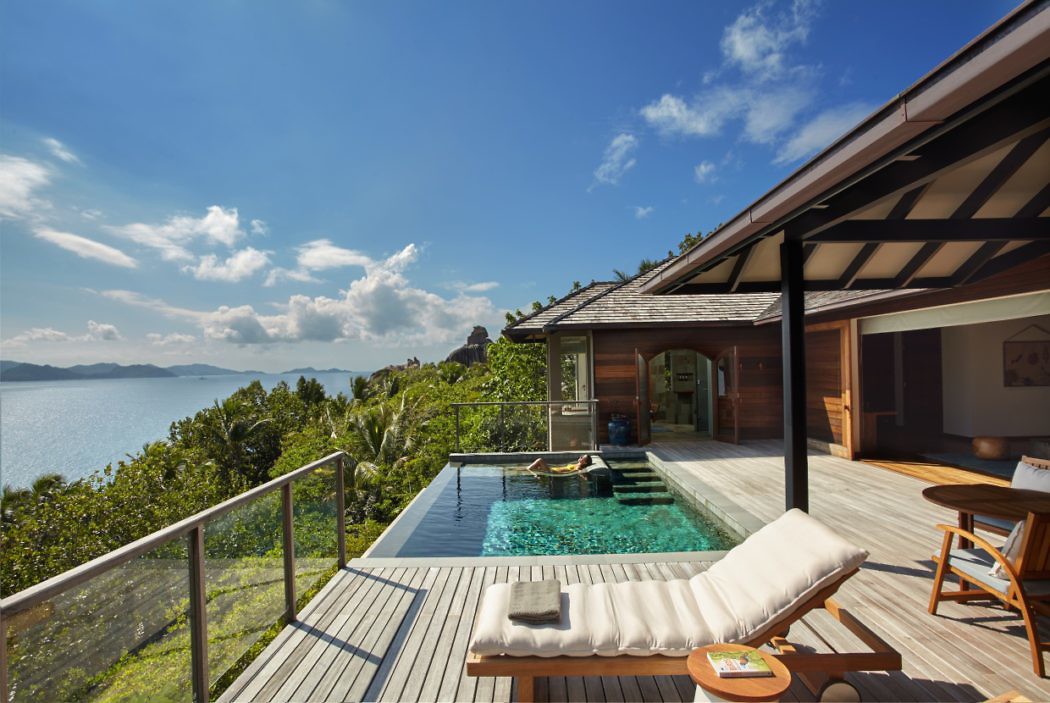 Seaside villa deck with infinity pool overlooking the ocean.