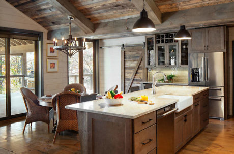 Rustic kitchen with modern appliances and a dining area.