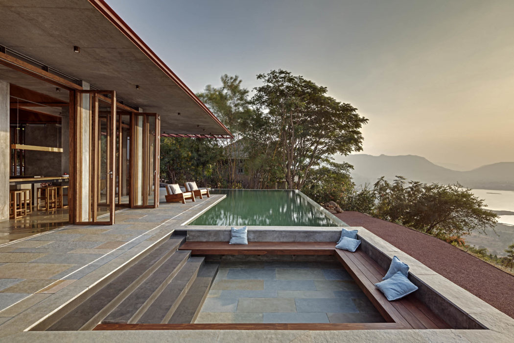 Hillside home with infinity pool and panoramic views.