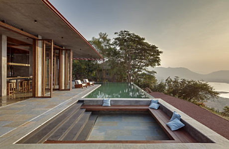 Hillside home with infinity pool and panoramic views.