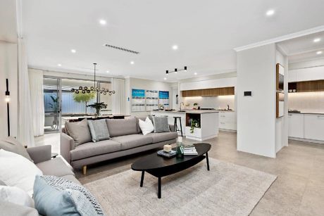 Modern open-plan living room with kitchen and dining area.
