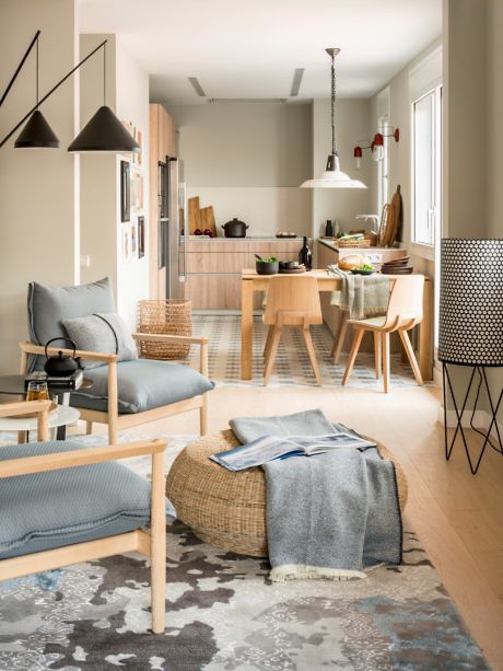 Modern living room with Scandinavian design, adjoining dining area.
