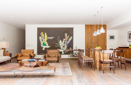 Contemporary living space with leather furniture and wooden accents.