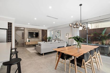 Modern open-plan living room with dining area and stylish furnishings.