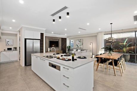 Modern kitchen with island, dining area, and open-plan layout.