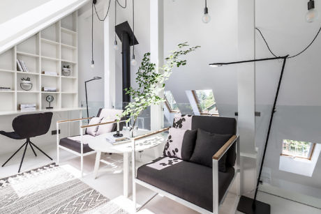 Minimalistic living room with monochrome palette and clean lines.