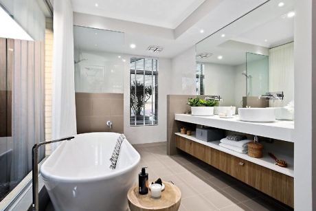 Sleek bathroom with freestanding tub and double vanity.