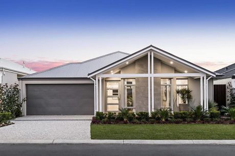 Contemporary single-story home with large windows and gabled roof.