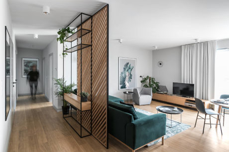 Contemporary living room with sleek furnishings and wooden floors.