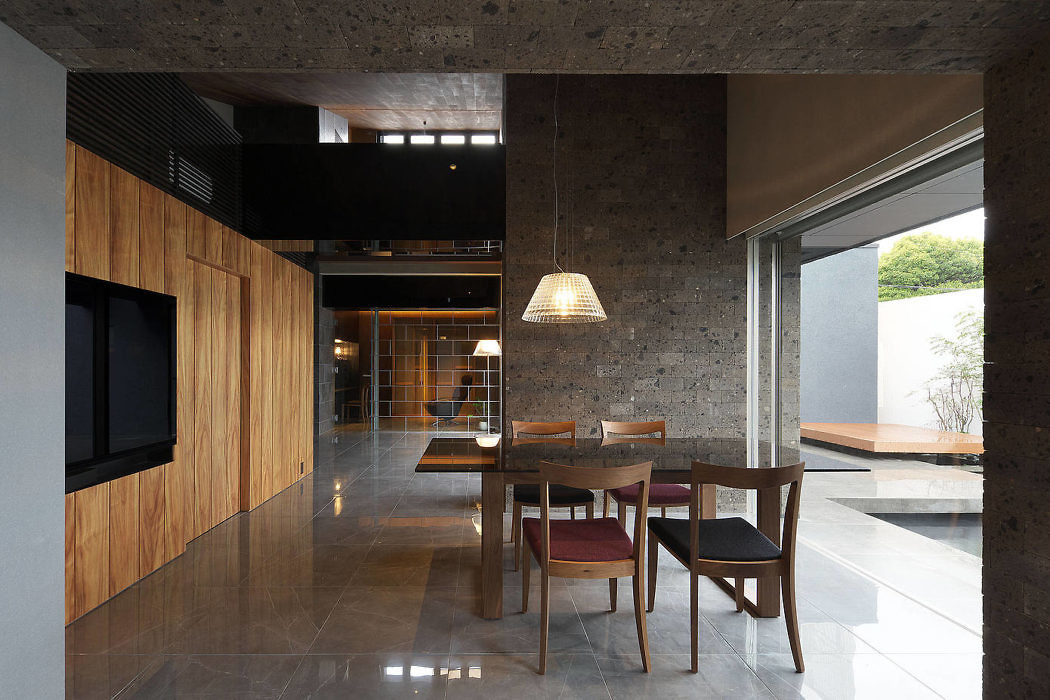 Contemporary dining space with wood accents and concrete textures.