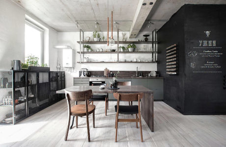 Contemporary kitchen with sleek wooden furniture and monochrome palette.