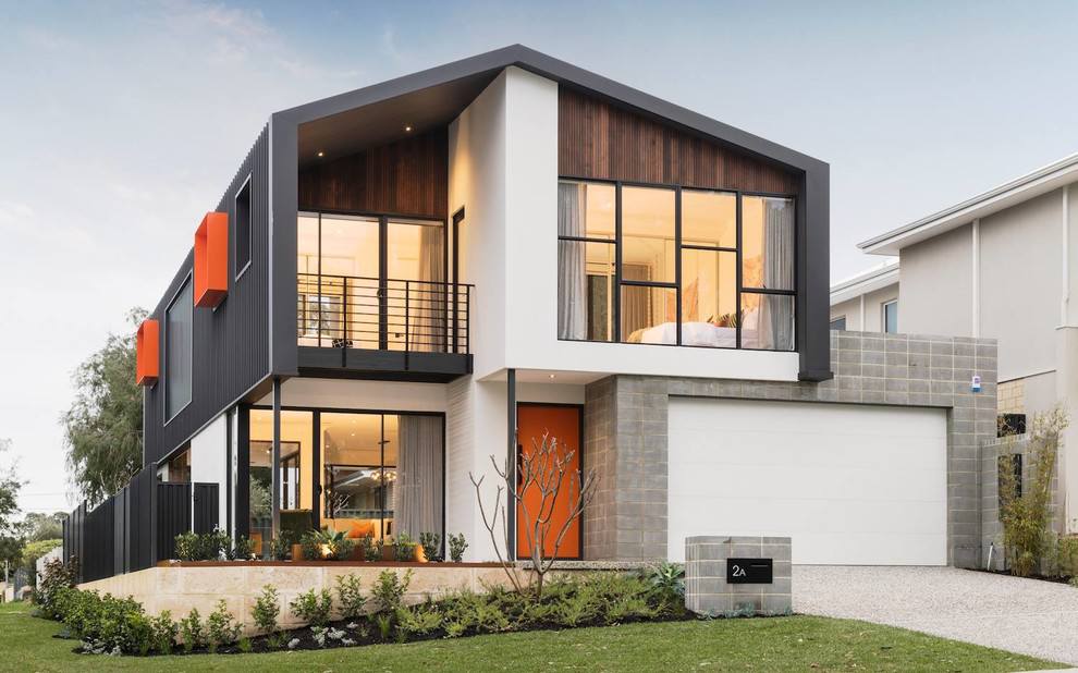 Contemporary two-story home with mixed materials and bold accents.