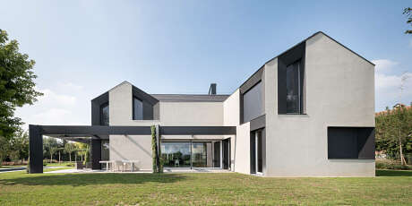 Contemporary architectural design featuring clean lines, large windows, and a sleek, minimalist aesthetic.