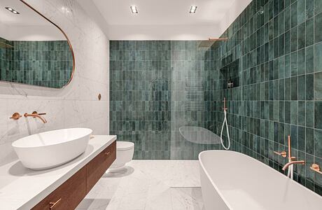 Elegantly designed bathroom with green tile walls, white vanity, and marble flooring.