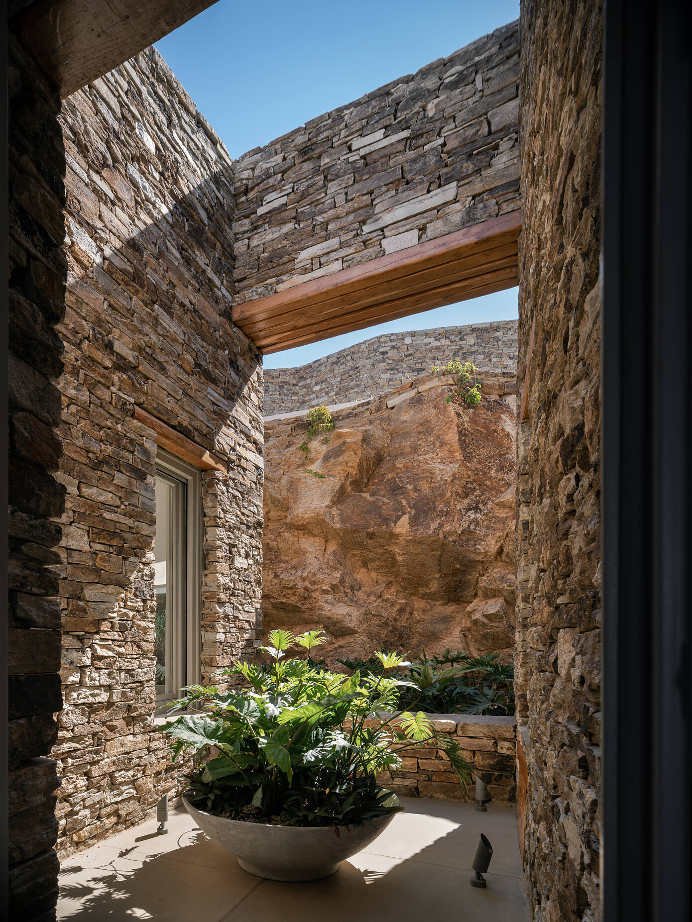 Encaved Stone Villa by Tsolakis Architects