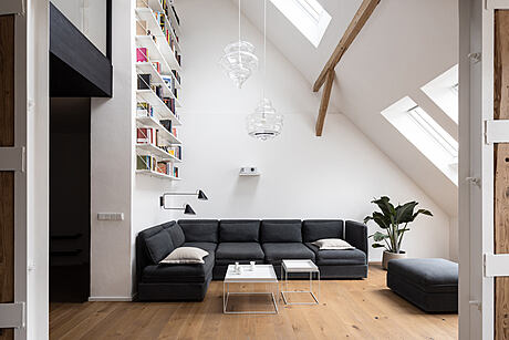 Attic Apartment with a Black Box by Komon Architekti - 1