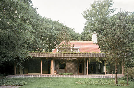 BD House: A Playful Brick Home in a Pine Forest