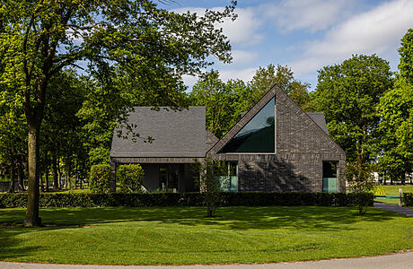 House with Four Roofs: Merging Modern Architecture with Rural Charm