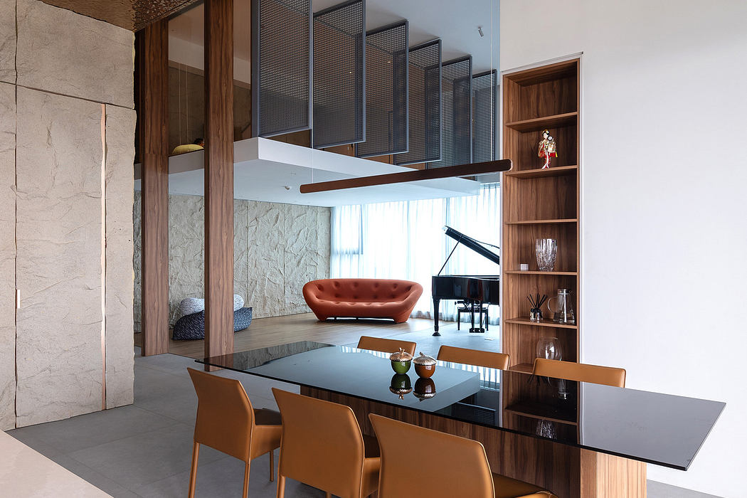 Modern dining area with textured ceiling, wooden cabinetry, and sleek chairs.