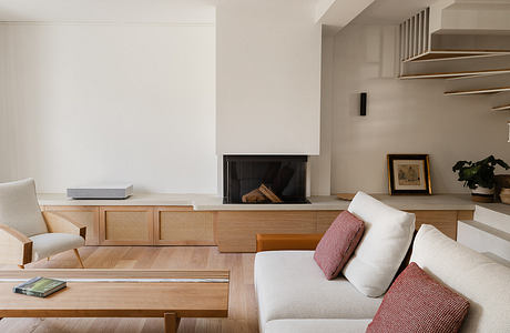 Modern living room with minimalistic furniture and neutral tones.