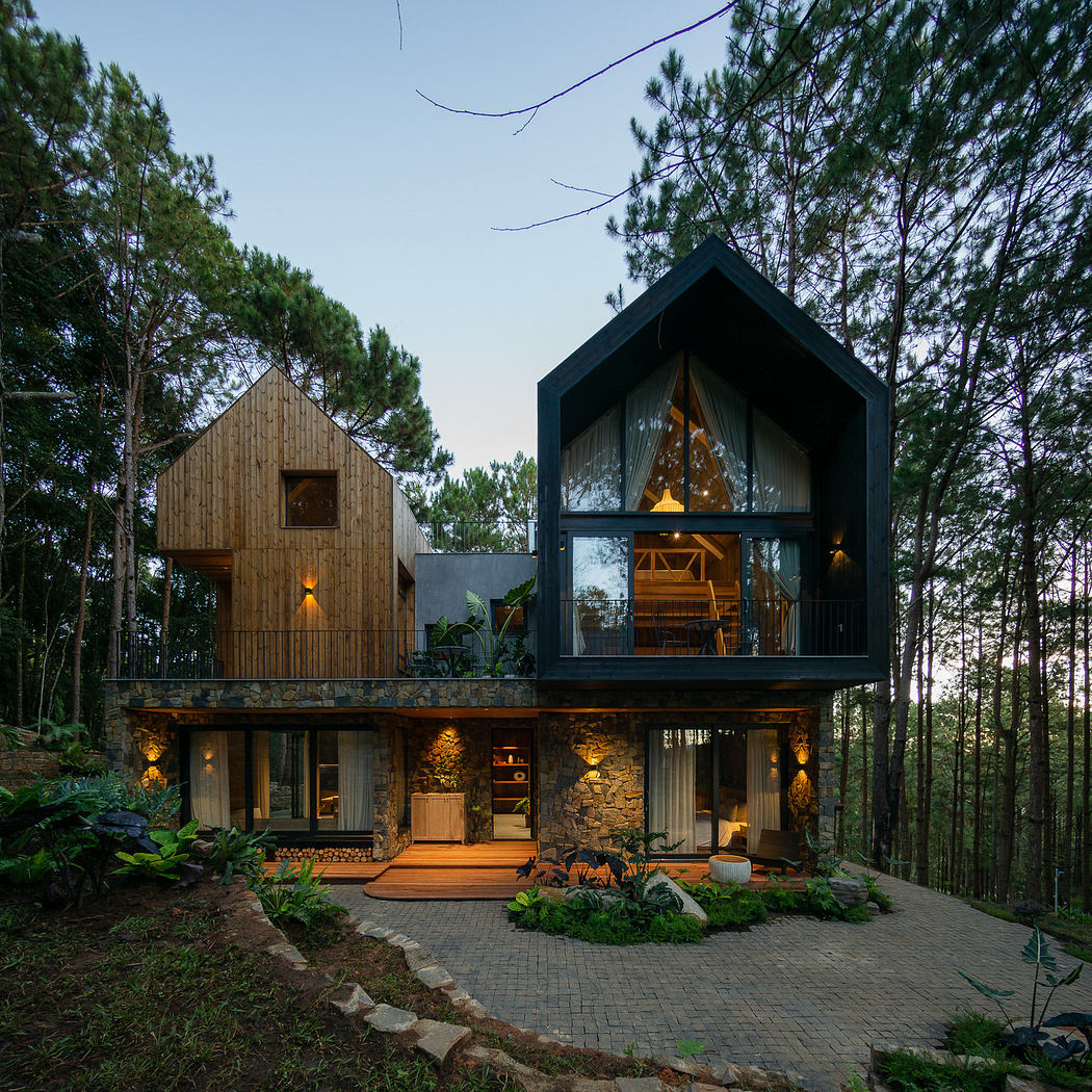 Modern two-story house with mixed-material facade surrounded by trees at dusk.