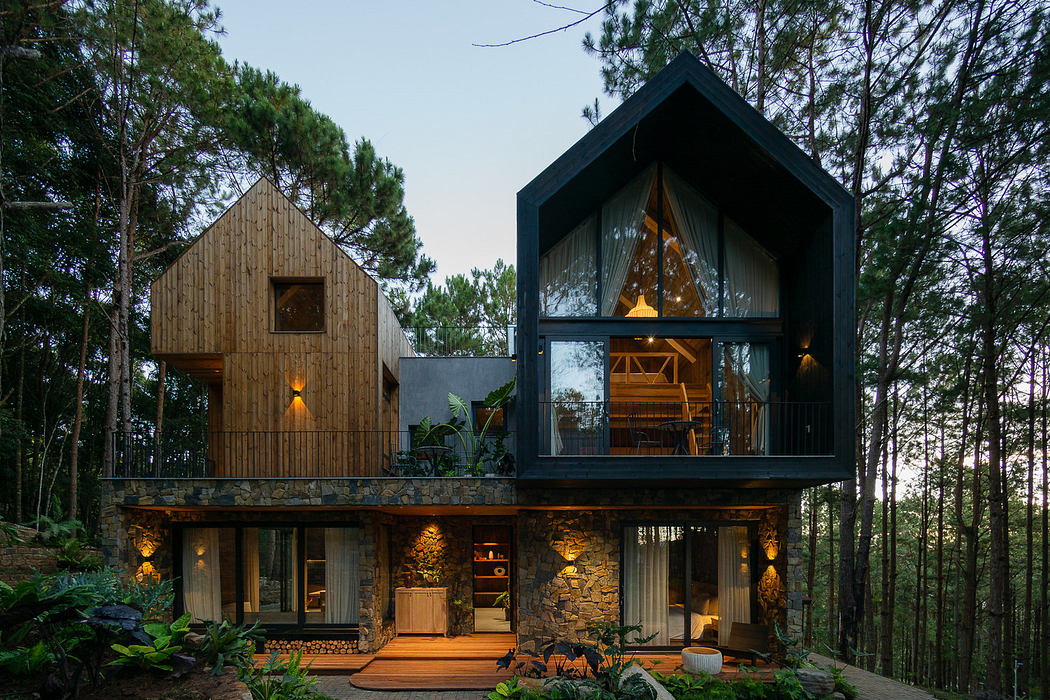 Modern two-story house with mixed-material facade surrounded by trees at dusk.