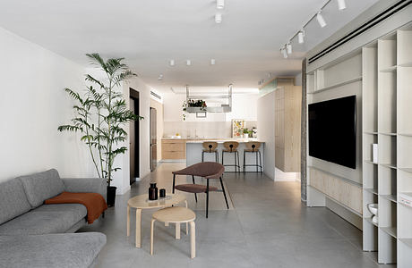 Modern minimalist living room with neutral tones and clean lines.