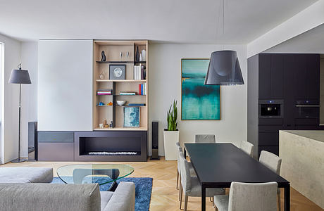 Modern living room with sleek furniture and abstract art.