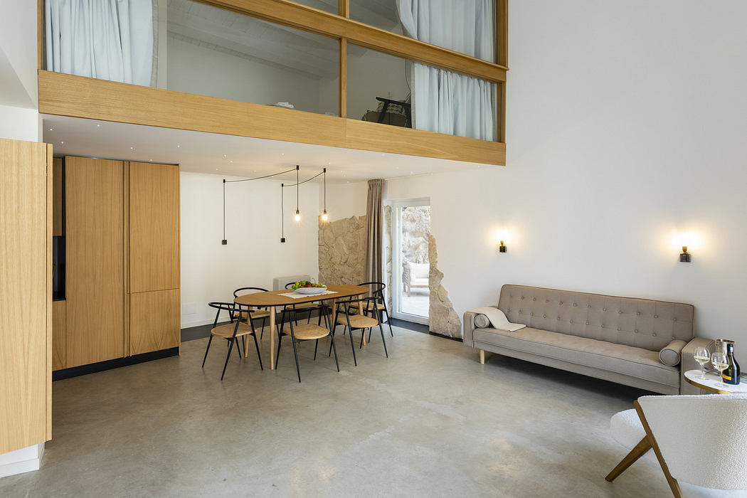 Modern interior with wooden accents, mezzanine, and minimalist furniture.