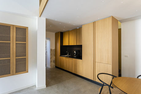 Modern kitchen with sleek wood cabinetry and minimalist design.