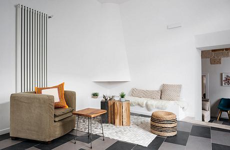 Contemporary living room with checkered floor and minimalist decor.