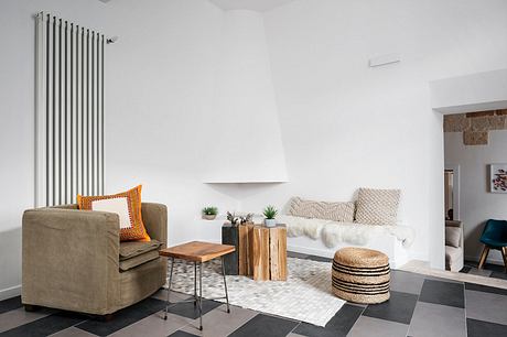 Contemporary living room with checkered floor and minimalist decor.