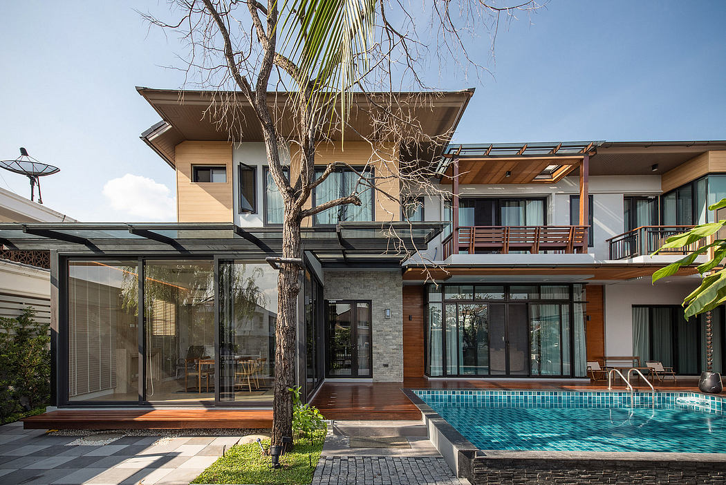 Contemporary house with pool and glass facade.