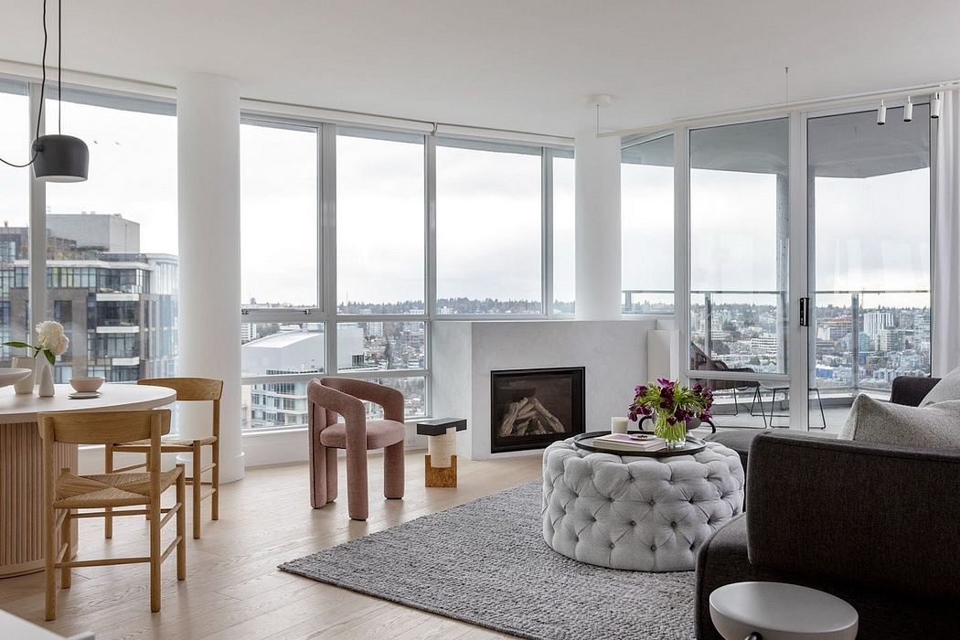 Sleek living space with large windows, city view, and minimalist decor.