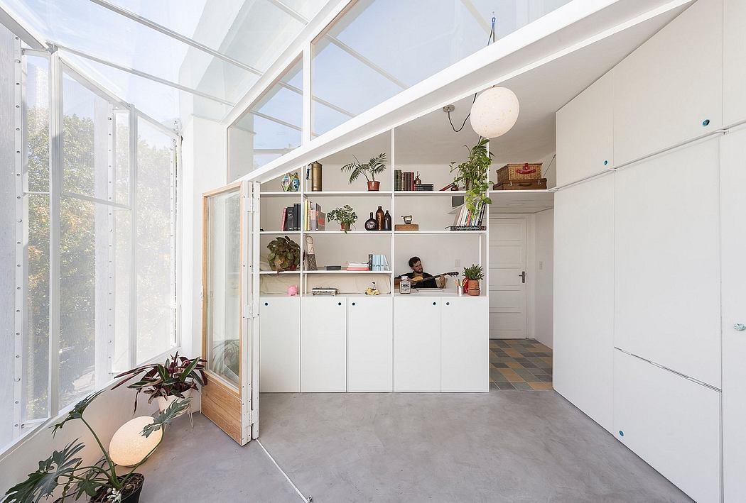Bright, airy kitchen with glass walls and minimalist design.