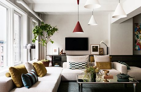 Chic living room with contrasting accents and plush seating.