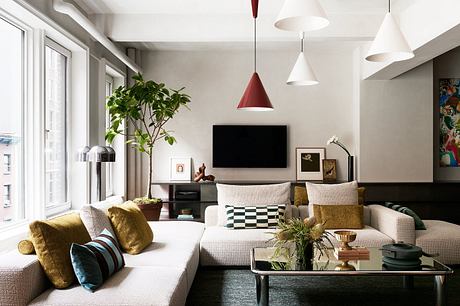 Chic living room with contrasting accents and plush seating.